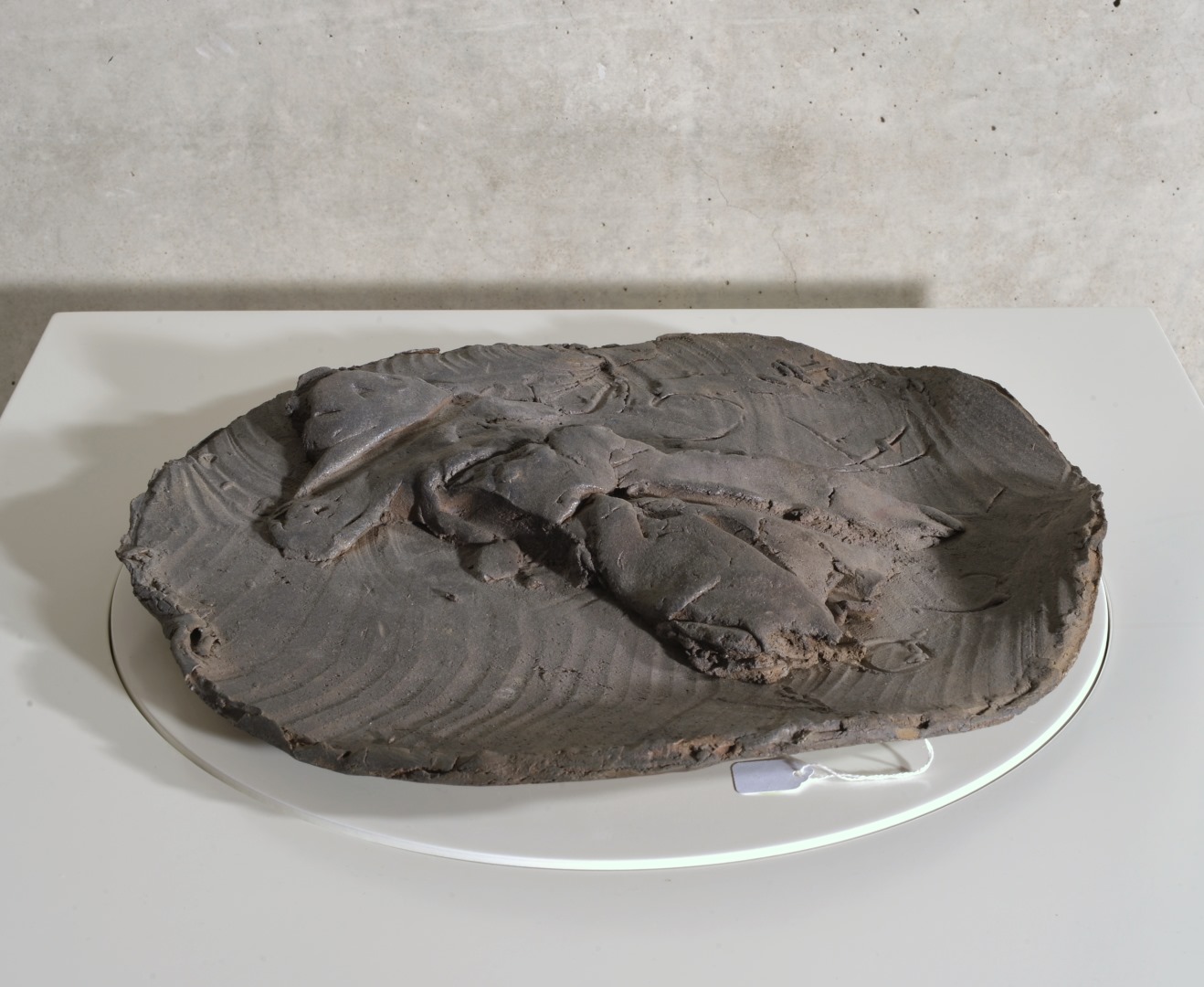 Large slab-built stoneware charger with figure