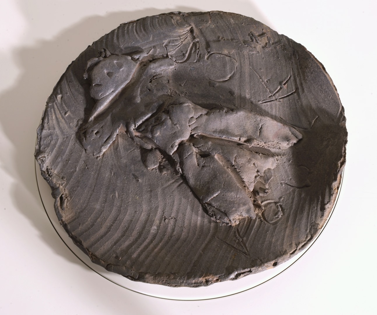 Large slab-built stoneware charger with figure